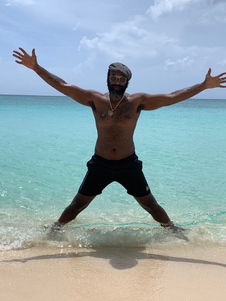 Reggae Artist Stuart Wilson on the Beach in the Cayman Islands